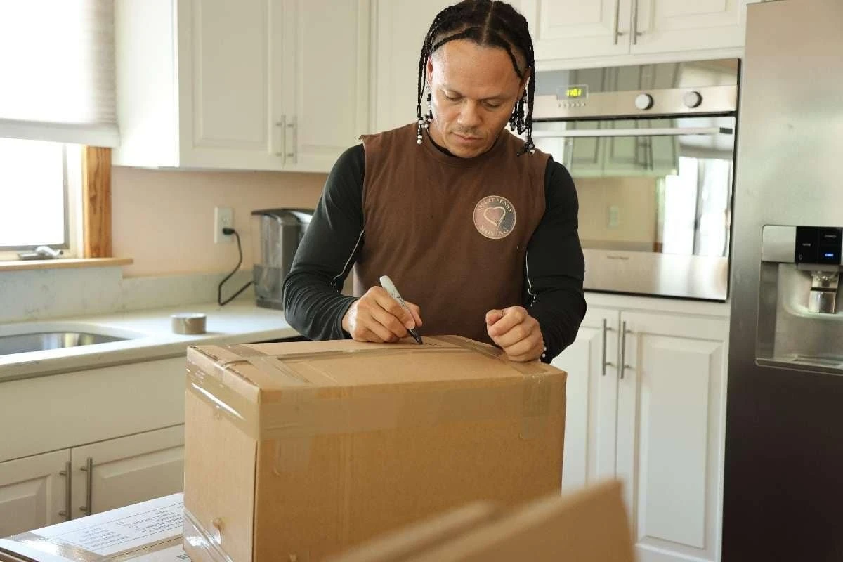 Smart Penny Moving crew packing a Belmont home